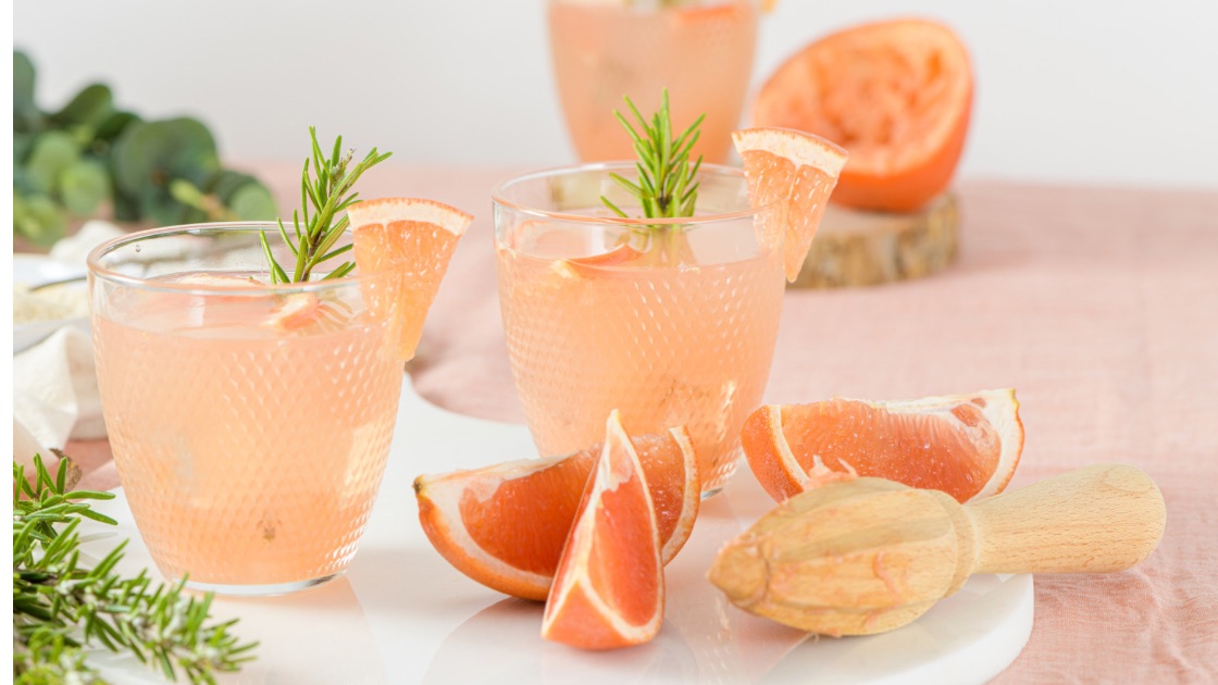 Grapefruit Spritzer with gin and a sprig of rosemary